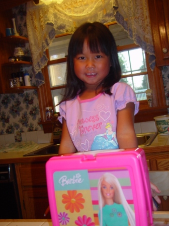 Kasen with her Barbie lunch box